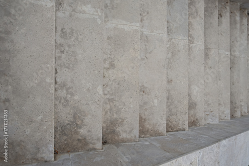 Granite staircase top view. Abstract architectural gray background. City stairs in parks, squares, embankments. Close-up of the stone steps. Conceptual modern minimalistic design, parallel lines