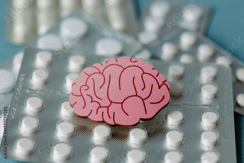 Pink brain with pills. Awareness of brain diseases. Prevention od dementia