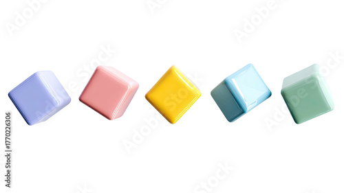 Tilted row of pastel-colored, glossy square blocks on black backdrop