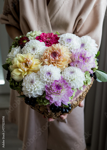 Woman holding bright bouquet
