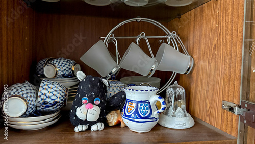 Quadro su tela Whimsical porcelain cat guards eclectic crockery amid Nordic Yule vibes, invokin