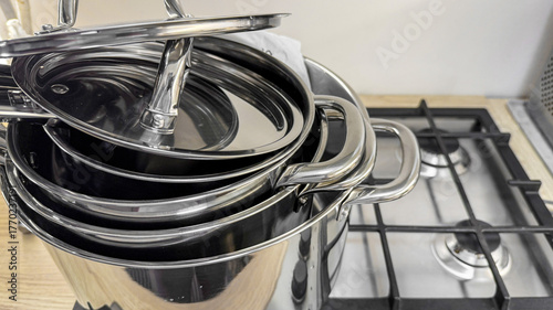 Fotografie Stacked gleaming pots echo culinary alchemy, whispering of winter solstice feast