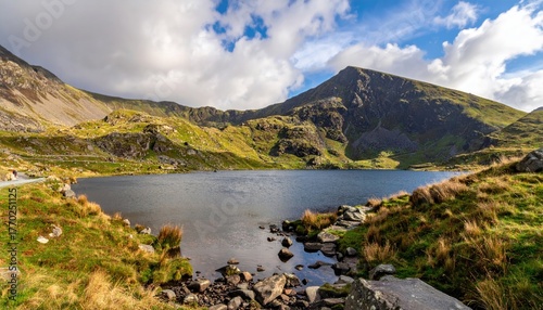 Mountain lake, dramatic scenery, sunlight on peaks