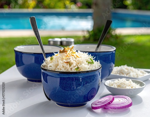 Three bowls of rice, vibrant blue, outdoor setting