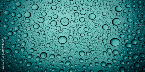 Water droplets on a teal surface a close-up shot ideal for backgrounds and textures