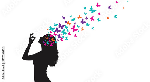 Silhouette of a woman with colorful butterflies flying out of her head, symbolizing creativity and imagination.
