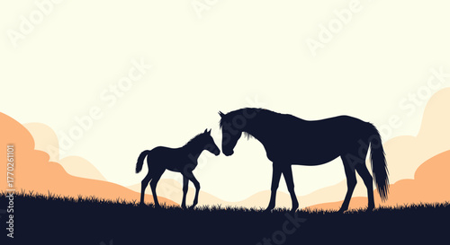 Silhouette of a mare and her foal standing in a grassy field with rolling hills and a warm, tranquil sky in the background.