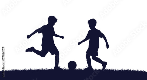 Two children playing soccer in a silhouette against a bright background, showcasing outdoor activity and sport.