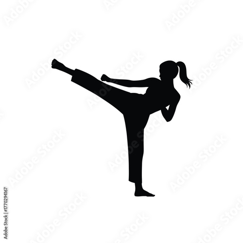 Dynamic Female Martial Artist Silhouette Executing High Kick