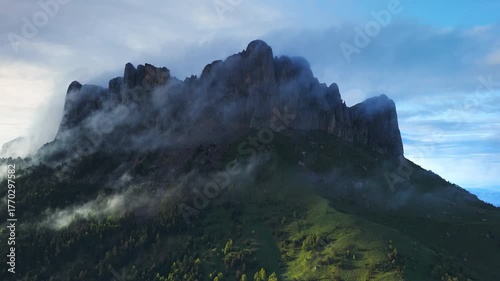 Bolshoy Tkhach mount with clouds and evening sunlight. Drone panoramic view