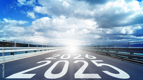 The year 2025, 2026 marked on an asphalt runway leading towards a bright future. Happy New Year Background Design. New Year concept, journey ahead, future vision, goal setting, end of year transition.
