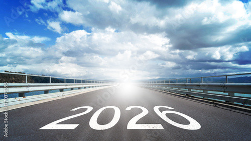 The year 2026 marked on an asphalt runway leading towards a bright future. 2026 Happy New Year Background Design. New Year concept, journey ahead, fresh start, future vision, goal setting, end of year