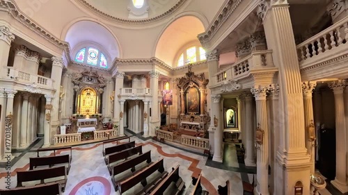 Modena, Italy - Oct 25, 2025: Baroque architecture filling the Sanctuary of the Blessed Virgin Helper of the Modenese People, featuring ornate columns and an altar. 360 top view of St George church