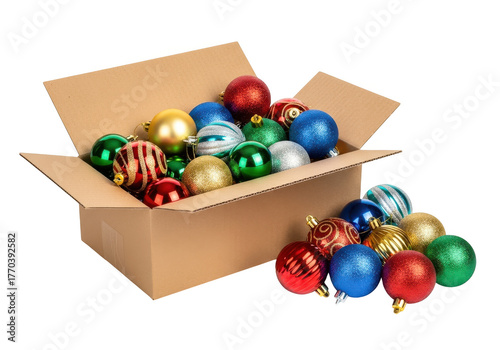 A cardboard box overflowing with colorful christmas ornaments scattered around isolated on transparent background