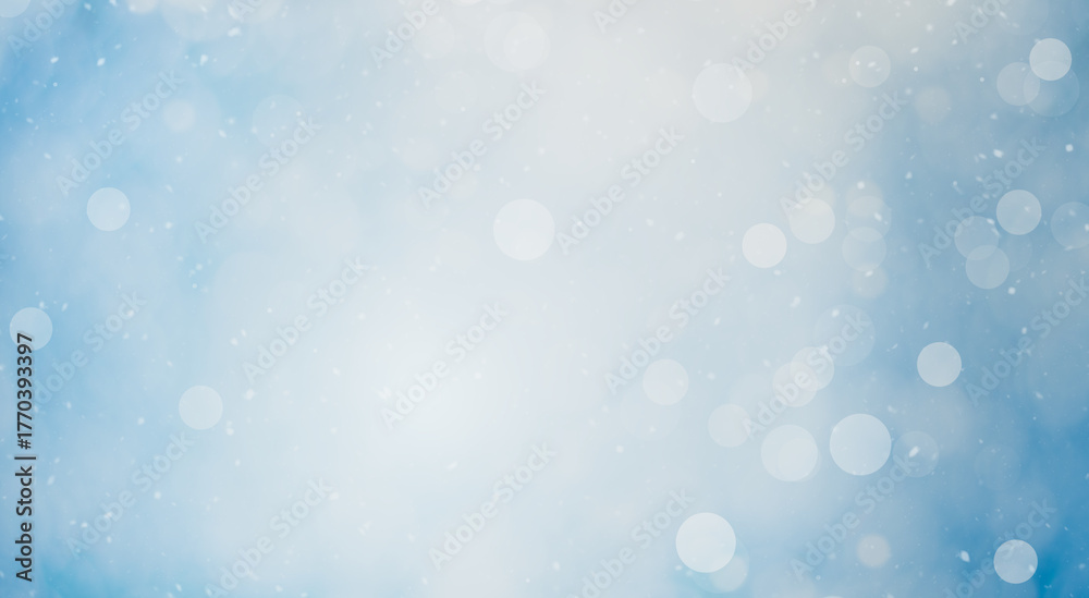 Obraz premium light blue winter background with defocused lights (bokeh)