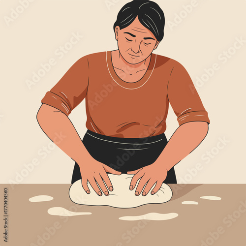 An older woman in a brown shirt and black apron kneads dough on a beige surface with a neutral background