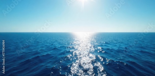 Vast, deep blue ocean stretches to the horizon, untouched and serene Sunlight glints on the endless water, creating a mesmerizing display of light and shadow , exploration, color