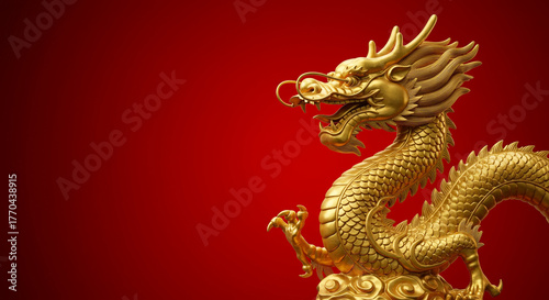 Golden dragon statue on a red surface with copyspace, symbol of power and prosperity