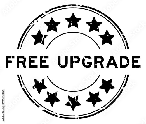 Grunge black free upgrade word round rubber seal stamp on white background