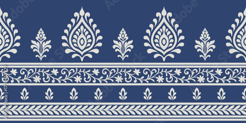 Indian ethnic pattern with elegant floral and leaf motifs in cream on blue background creating beautiful traditional design