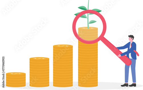 A businessman examines a chart with a blooming dollar coin plant using a magnifying glass,

