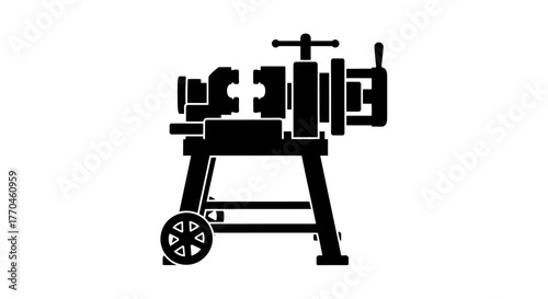 A black and white silhouette illustration of a vintage pottery wheel