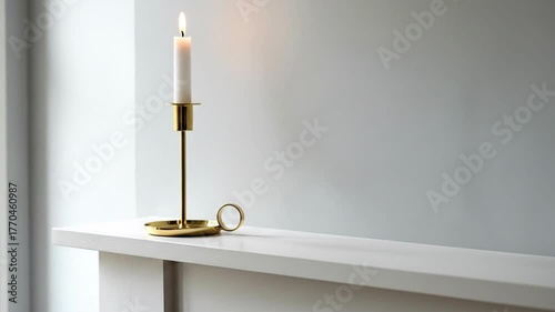 Elegant brass candlestick radiates warm light for minimalist hygge home decor 