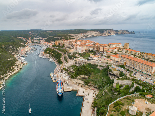 Aerial view marina cape Bonifacio south Corsica France citadel on rocky promontory on wild white limestone cliffs