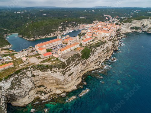 Aerial view marina cape Bonifacio south Corsica France citadel on rocky promontory on wild white limestone cliffs