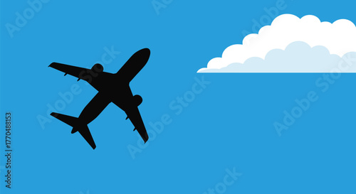 Silhouette of an airplane flying against a blue sky with white clouds