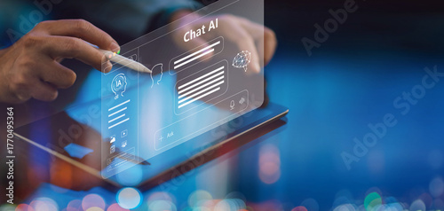Businessman using chat AI on tablet for information and productivity assistance. Everyday work with artificial intelligence smart technology concept.