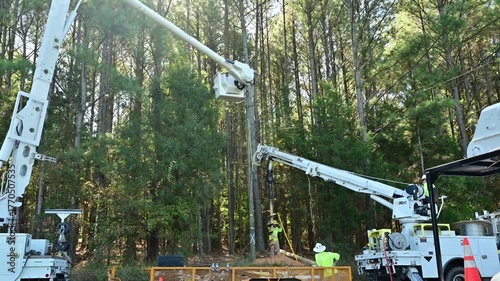 Installing a new electric power pole in a rural area