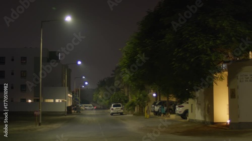 Night time in Sar, Bahrain, houses and street with light traffic