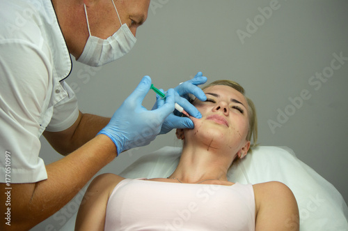 doctor gives beauty injections to a woman
