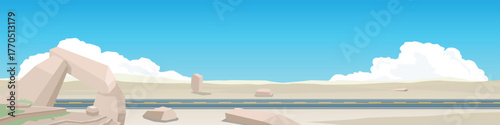 Landscape or topography of smooth asphalt road. On a dry area of ​​sand. Looking at only sand dunes. And interspersed with strange rocks. Under the blue sky and white clouds. For banner background.