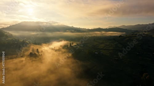 A stunning experience of a foggy landscape during a beautiful sunrise
