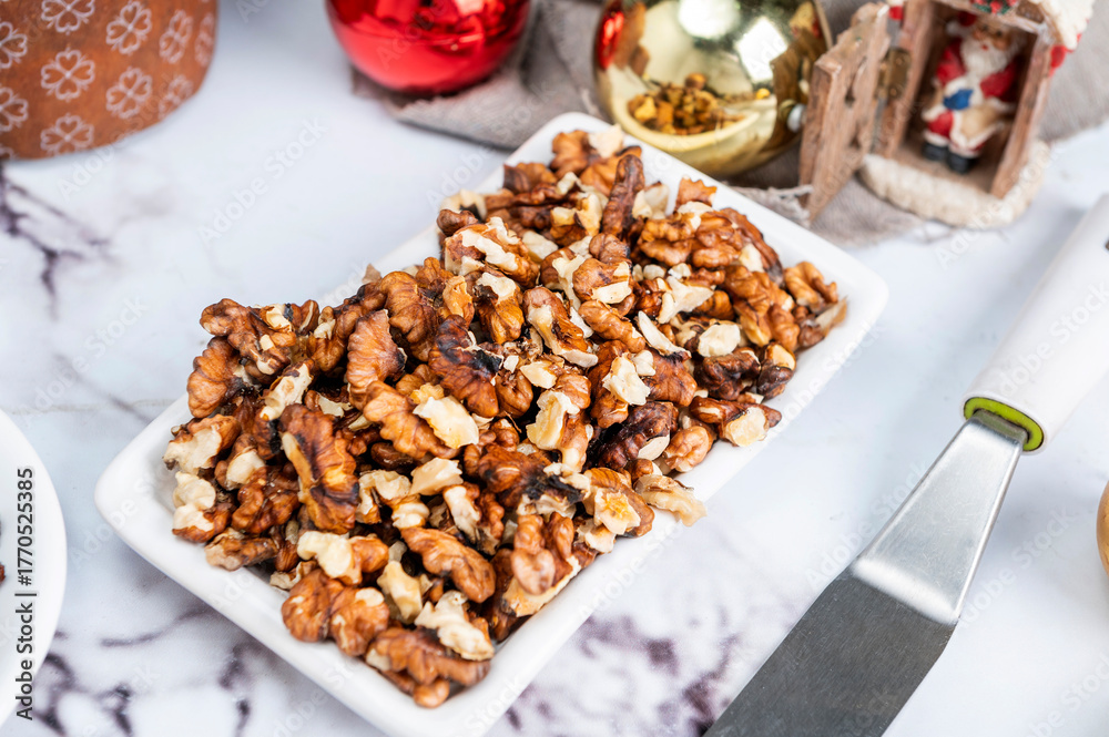 Fototapeta premium Homemade sweet bread filled with chocolate, dried fruits, walnuts, almonds, peanuts, candied nuts, raisins, and fruit, Christmas and Thanksgiving holiday bread.