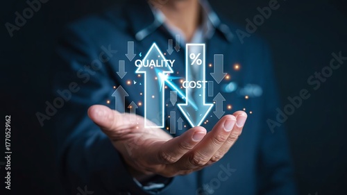 Businessman holding virtual hologram of rising quality and falling cost concept
