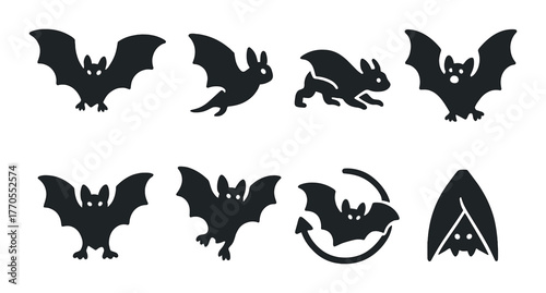 Silhouette patterns of bats in various flying and resting poses on dark background