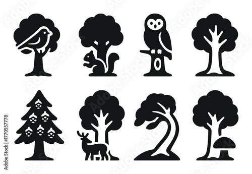 Silhouettes of woodland animals and trees on dark background