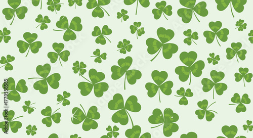 Green shamrock and lucky four-leaf clover seamless pattern on a light background, symbolizing good fortune and St. Patrick's Day.