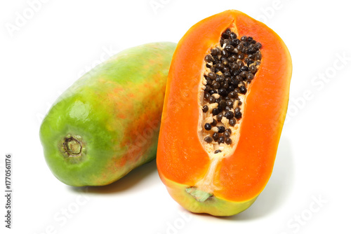 Whole papaya and ripe papaya cut in half to reveal the juicy flesh and seeds. isolated on white background.