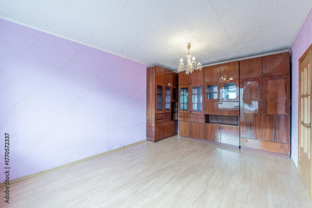 Obraz premium Empty, No People Living Room Interior. White Ceiling, Magenta Color Walls and Dark Brown Color Wooden Wardrobe.