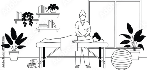 Therapist giving massage to woman on treatment table in tranquil spa room