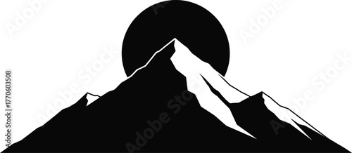 Striking silhouette of a solitary mountain peak illuminated by the dawn sun creating a majestic sunrise scene