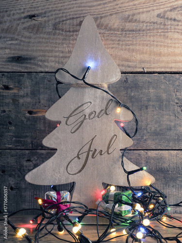God Jul, Scandinavian Christmas with a rustic wooden Christmas tree shape with Christmas lights