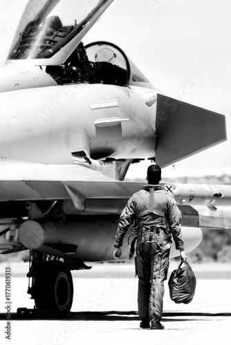 military aircraft and pilot on the ground