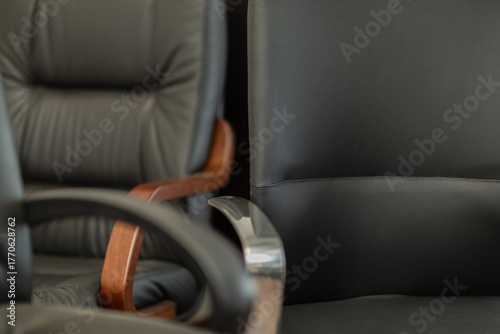 Close up detail of office arm chairs, nobody is visible.