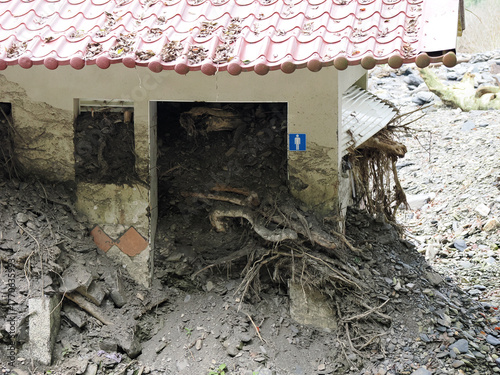 Close-up of Restroom Entrance Filled with Mudslide Debris