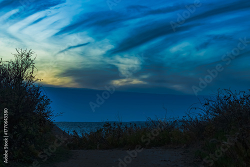 night sky with green light and clouds over Vineyard Sound